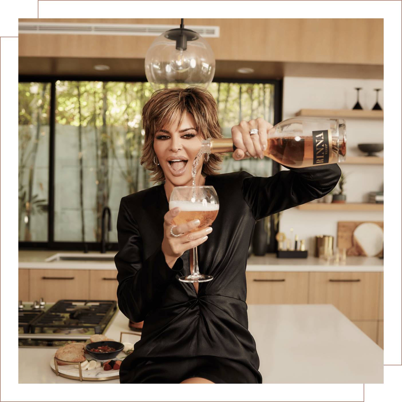 Lisa Rinna pouring herself a glass of BRUT ROSÉ!